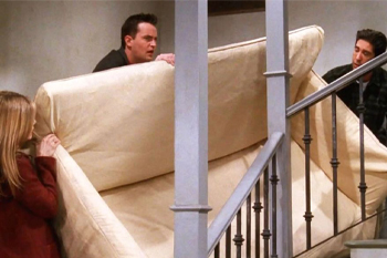 When Rachel, Chandler and Ross try to go up the stairs with the couch